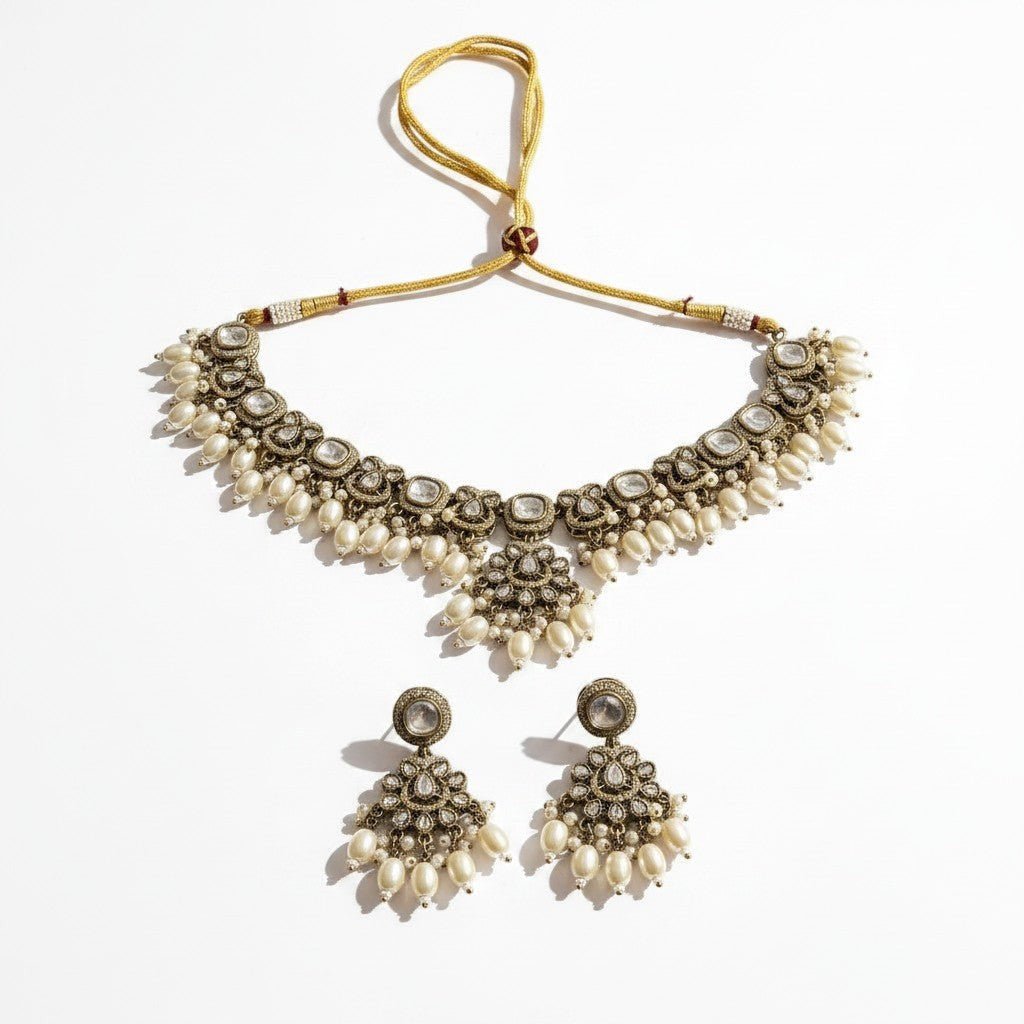 The Jewel Project silver pearl necklace set with matching Chandbali earrings, featuring intricate stonework and pearl drops.