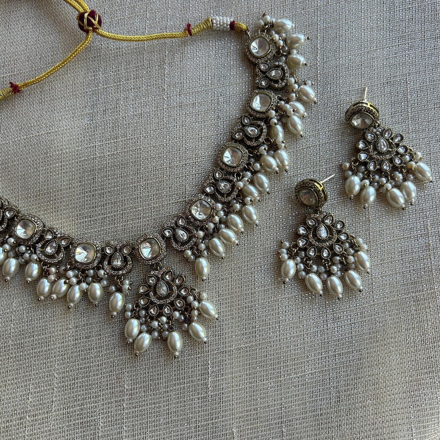 The Jewel Project antique silver necklace set with pearls and clear stones, includes matching Chandbali earrings.