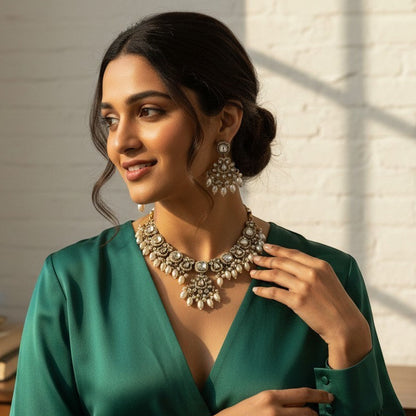 The Jewel Project silver pearl necklace set with matching Chandbali earrings, adorned with stones.