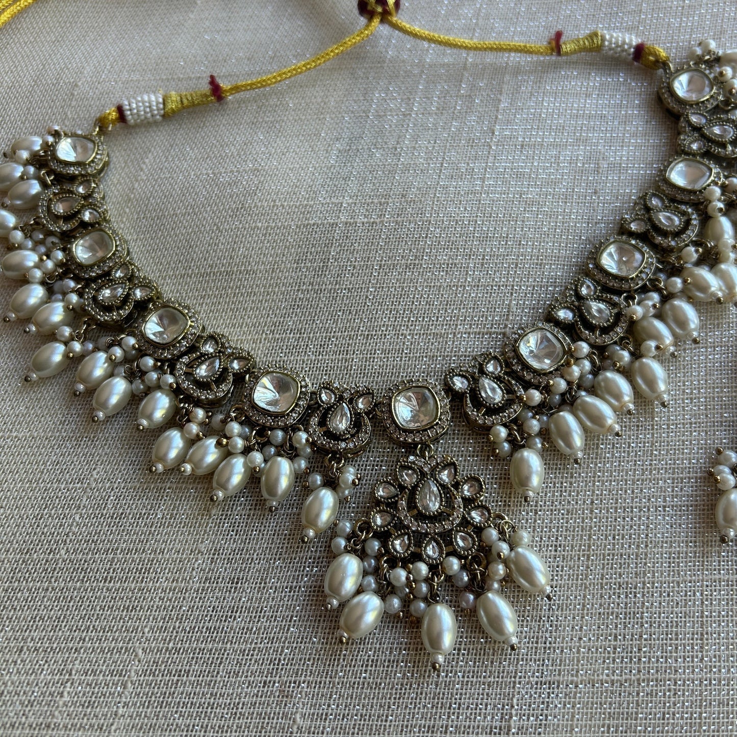 The Jewel Project antique silver necklace set with pearls and clear stones, includes matching Chandbali earrings.
