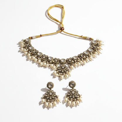 The Jewel Project silver pearl necklace set with matching Chandbali earrings, featuring intricate stonework and pearl drops.