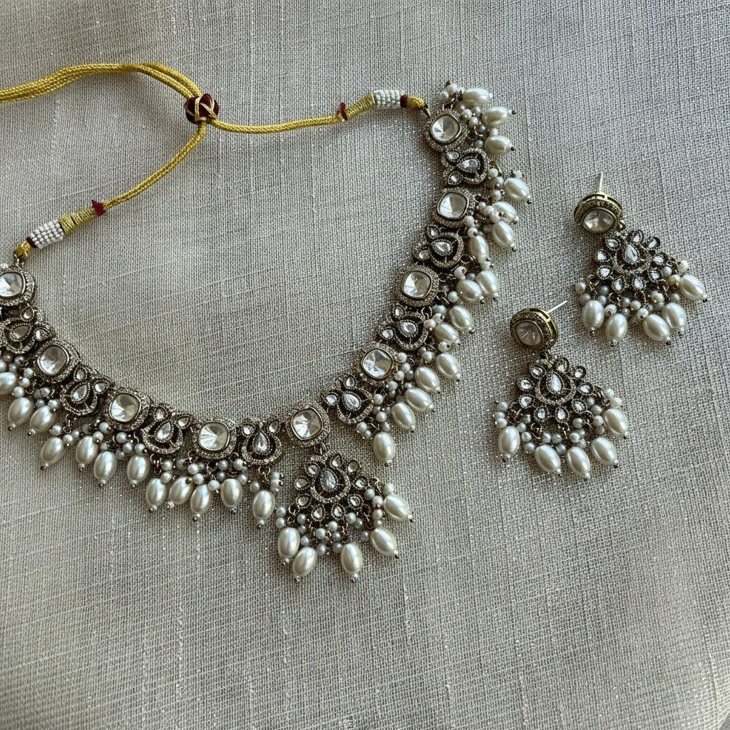 The Jewel Project silver necklace set with pearls and clear stones, includes matching Chandbali earrings.