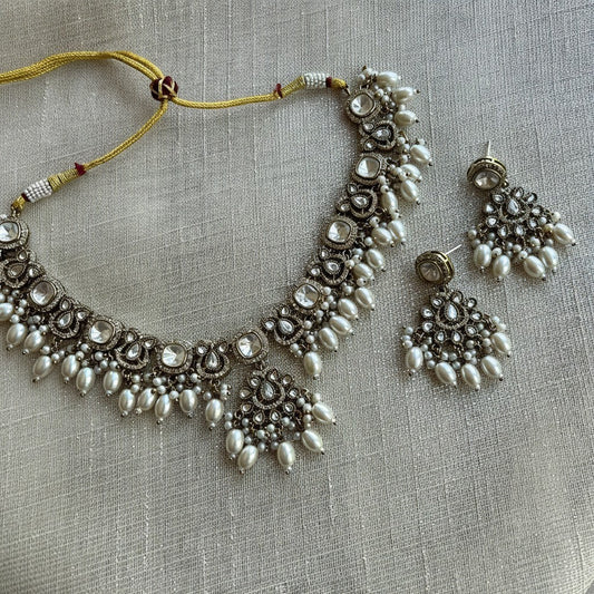 The Jewel Project silver necklace set with pearls and clear stones, includes matching Chandbali earrings.